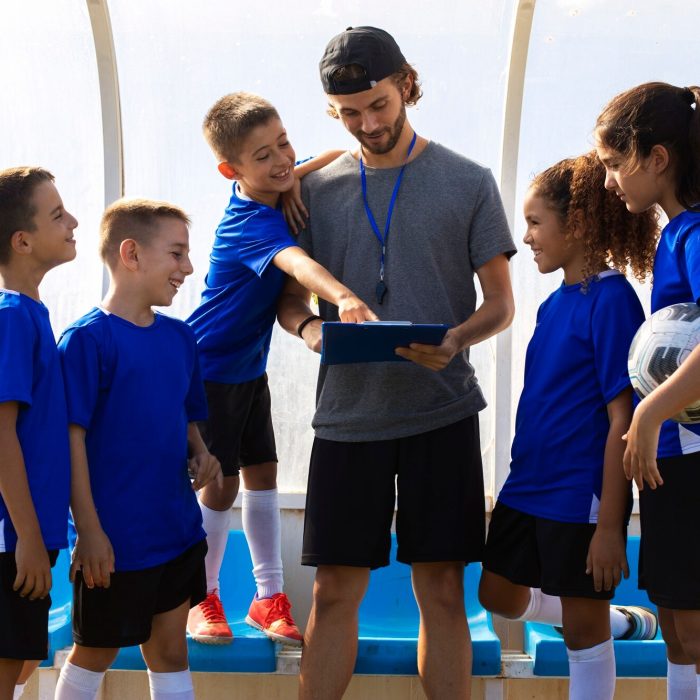 trainer-talking-players-front-view_23-2149742085